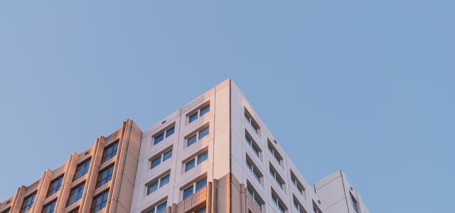 brown concrete building under blue sky by Niels Smeets courtesy of Unsplash.